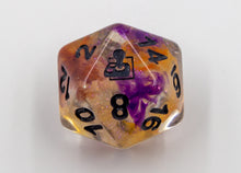 Load image into Gallery viewer, Close up of D20. Clear with orange and purple swirls, AbleGamers logo on the 20 spot.
