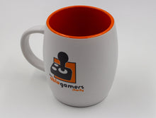 Load image into Gallery viewer, Downward view White Mug with the AbleGamers Logo (80s Joystick on orange square). The top of the mug going inside is shiny orange.
