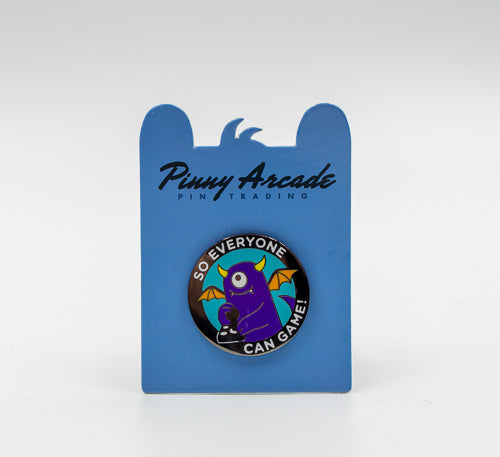 The Penny Pin (A moster playing with a joystick) on a blue card
